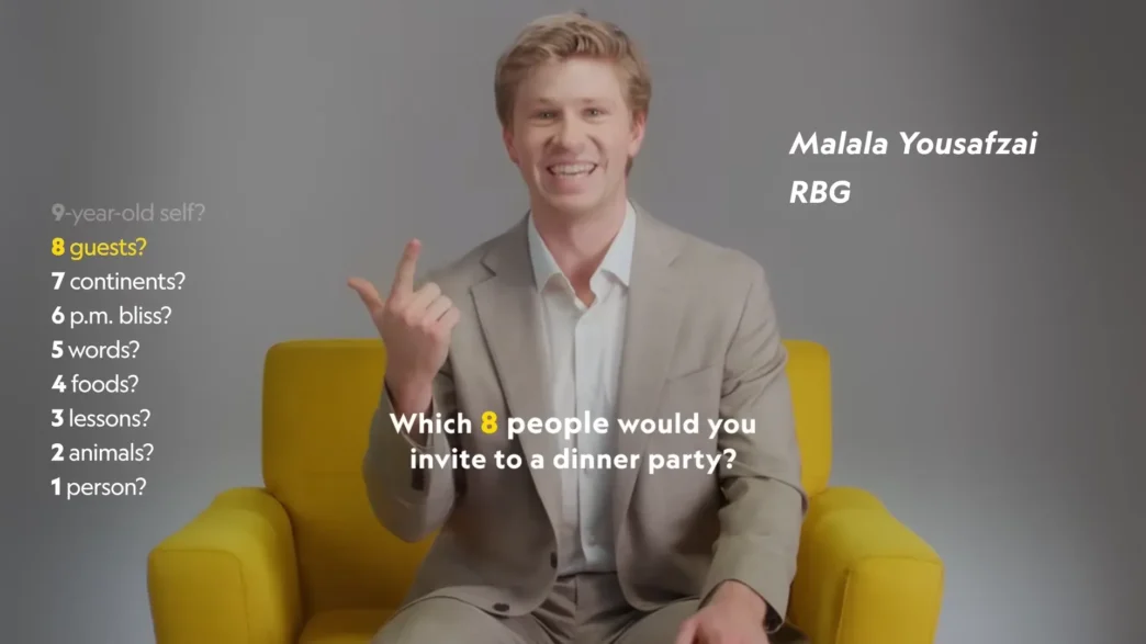 Robert Irwin smiling in National Geographic’s yellow chair during the Nat Geo 9 interview