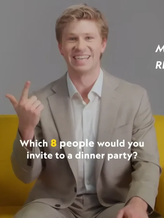 Robert Irwin smiling in National Geographic’s yellow chair during the Nat Geo 9 interview
