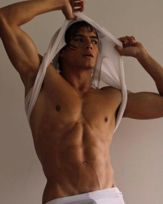 Rosemberg David Prisco Vásquez lounging during an underwear portrait session by Andrés Quigüa
