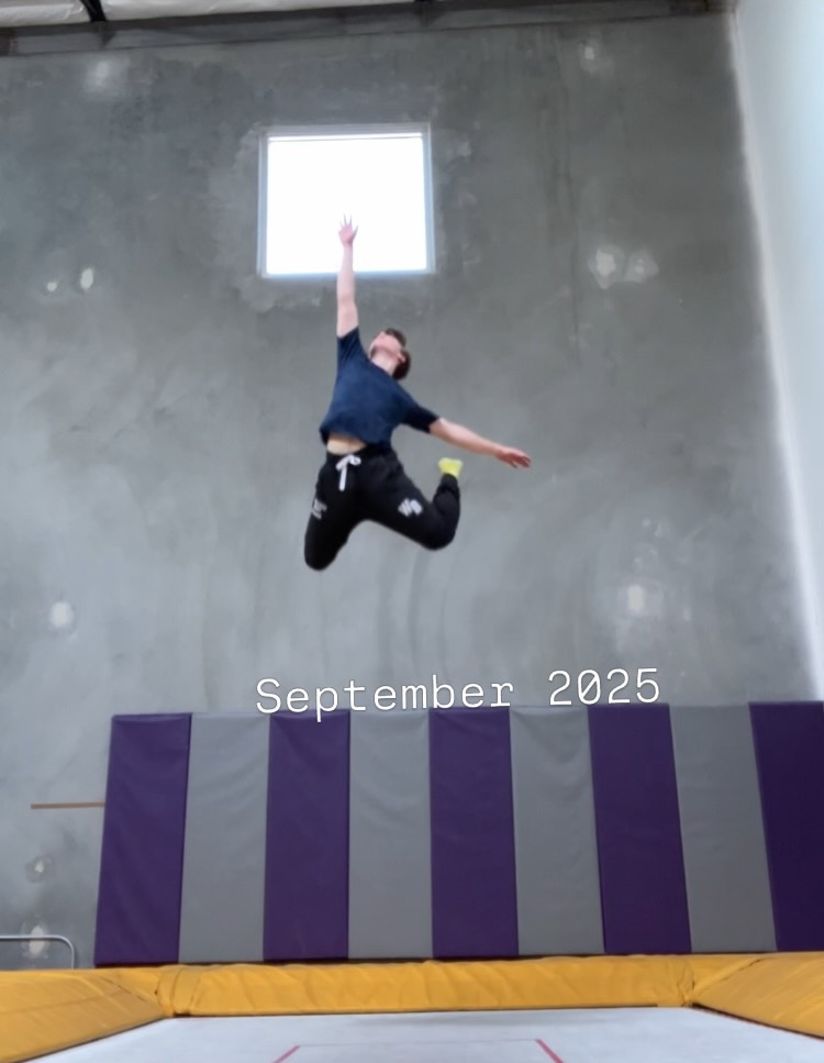 Iain Armitage leaping above a trampoline in a gym during September 2025