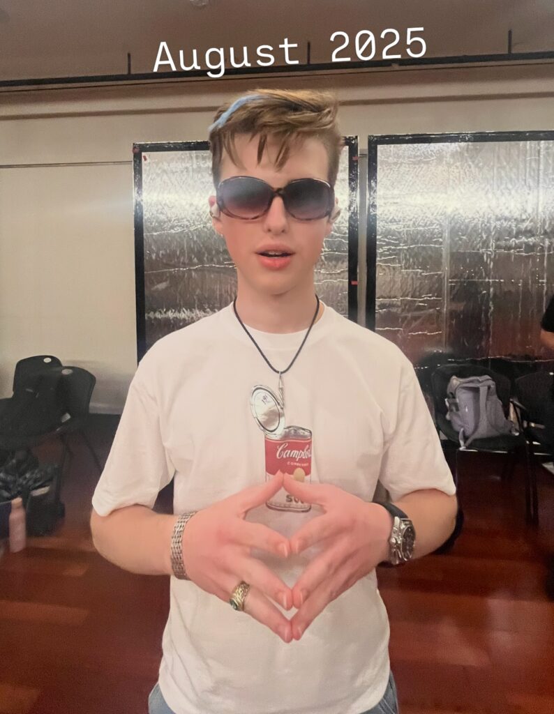 Iain Armitage wearing oversized sunglasses and a Campbell’s soup T-shirt in August 2025