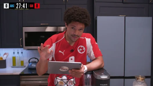 Ronny Chieng and Trevor Noah reacting during the Argentina versus Switzerland World Cup watch party