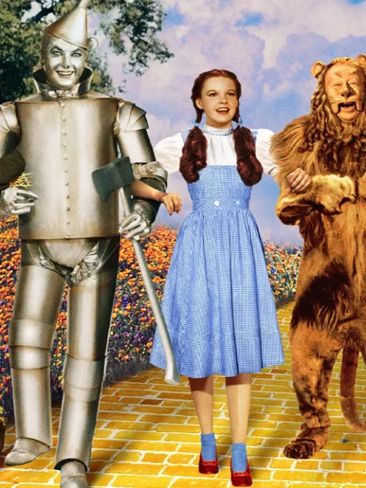 Dorothy, the Scarecrow, Tin Man and Cowardly Lion follow the Yellow Brick Road in The Wizard of Oz