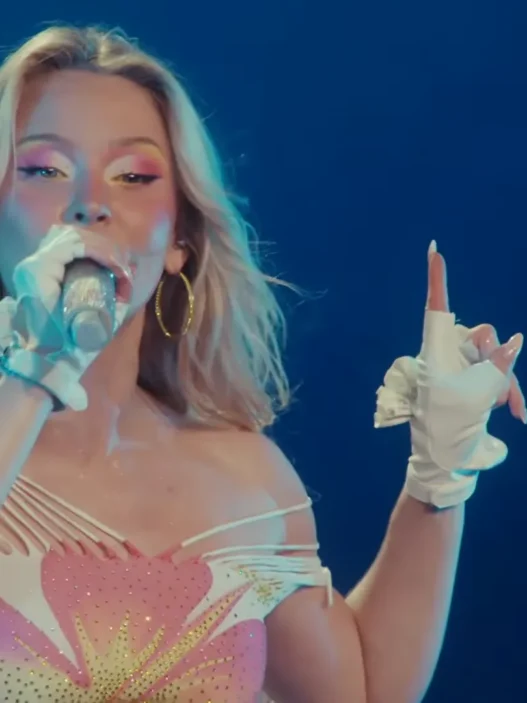 Zara Larsson performing beneath blue stage lights during her Montreux Jazz Festival 2026 set
