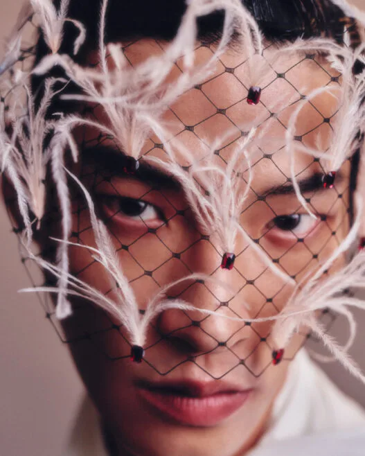 Ahn Jaehyung poses in a fashion editorial portrait photographed by Lee Seungjae.