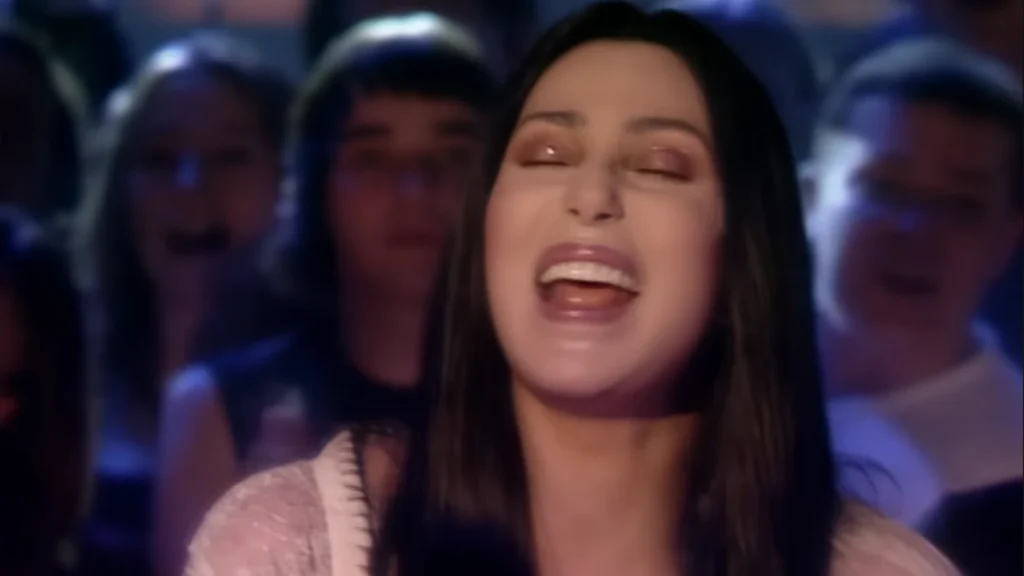 Cher performs All or Nothing under stage lights on Top of the Pops in June 1999