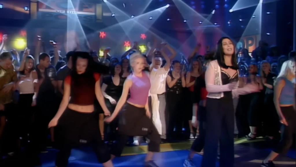 Cher on the Top of the Pops stage performing All or Nothing during the Believe era