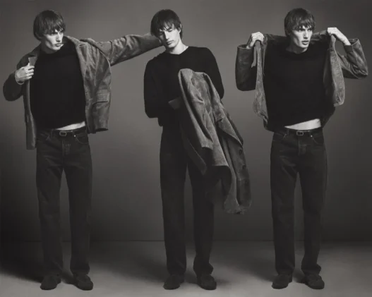 Thatcher Thornton modeling a camel crew neck and denim from FRAME’s Fall 2026 collection