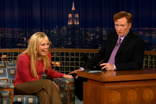 Hilary Duff laughing during her Late Night interview with Conan O’Brien