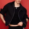 Michael Oder wearing an open dusty mauve shirt and layered silver necklaces for H&M Summer 2026