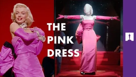 Marilyn Monroe’s pink satin dress from Gentlemen Prefer Blondes being examined for museum display