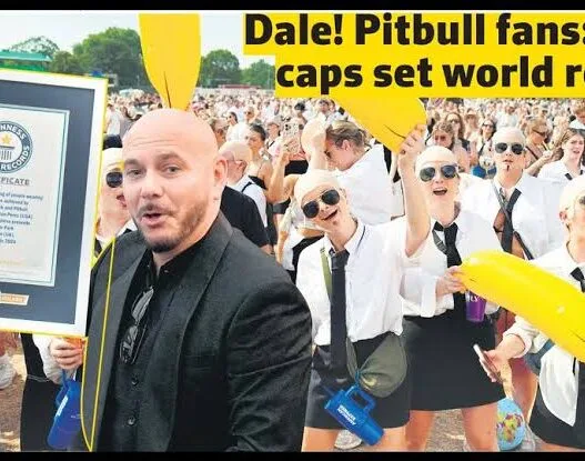Pitbull fans wearing bald caps, aviator sunglasses and black suits during the Guinness World Record attempt at BST Hyde Park