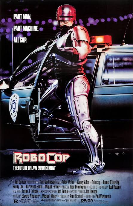 RoboCop stands beside a police car in the theatrical poster for the original 1987 film