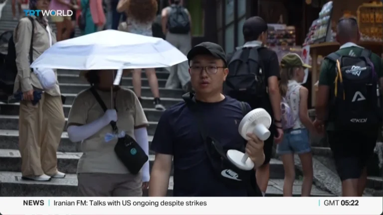 Japan’s summer heat has become so extreme that residents are carrying umbrellas, salt tablets and even full-size desk fans outside as temperatures hit 104°F.