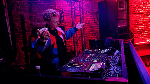 La Roux singer Elly Jackson performing a DJ set under red lighting at The Loft at Catch One in Los Angeles