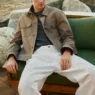 Callum Simpson posing against a seaside backdrop in Massimo Dutti’s Lumière du Midi editorial