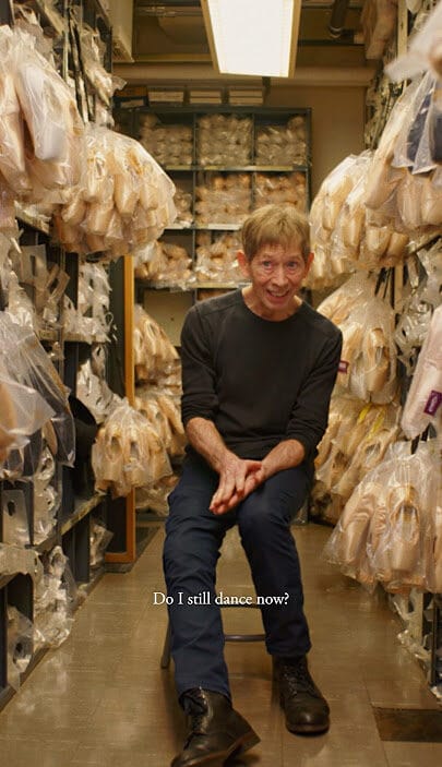 Tim Foster surrounded by pointe shoes inside the New York City Ballet shoe room