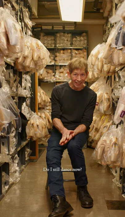 Tim Foster surrounded by pointe shoes inside the New York City Ballet shoe room