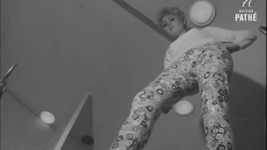Close view of flower-power boots and patterned stockings from a 1967 fashion feature