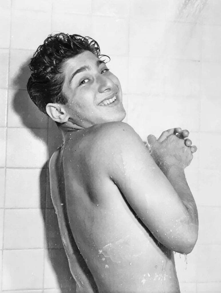 A young Paul Anka posing poolside during his teen-idol years