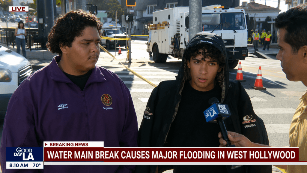 Two Supreme shoppers speaking with FOX 11 reporter Mario Ramirez during West Hollywood flooding