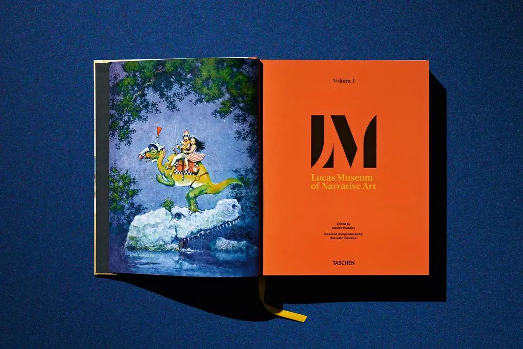 Open Lucas Museum of Narrative Art book showing illustrated front matter beside an orange Lucas Museum page.