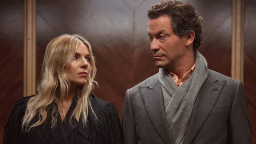 Sienna Miller as Carla Duval and Dominic West as Morgan Henderson in HBO’s legal drama WAR