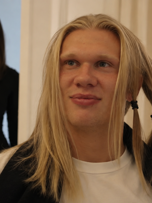 Erling Haaland gets his long blond hair trimmed ahead of the new football season.