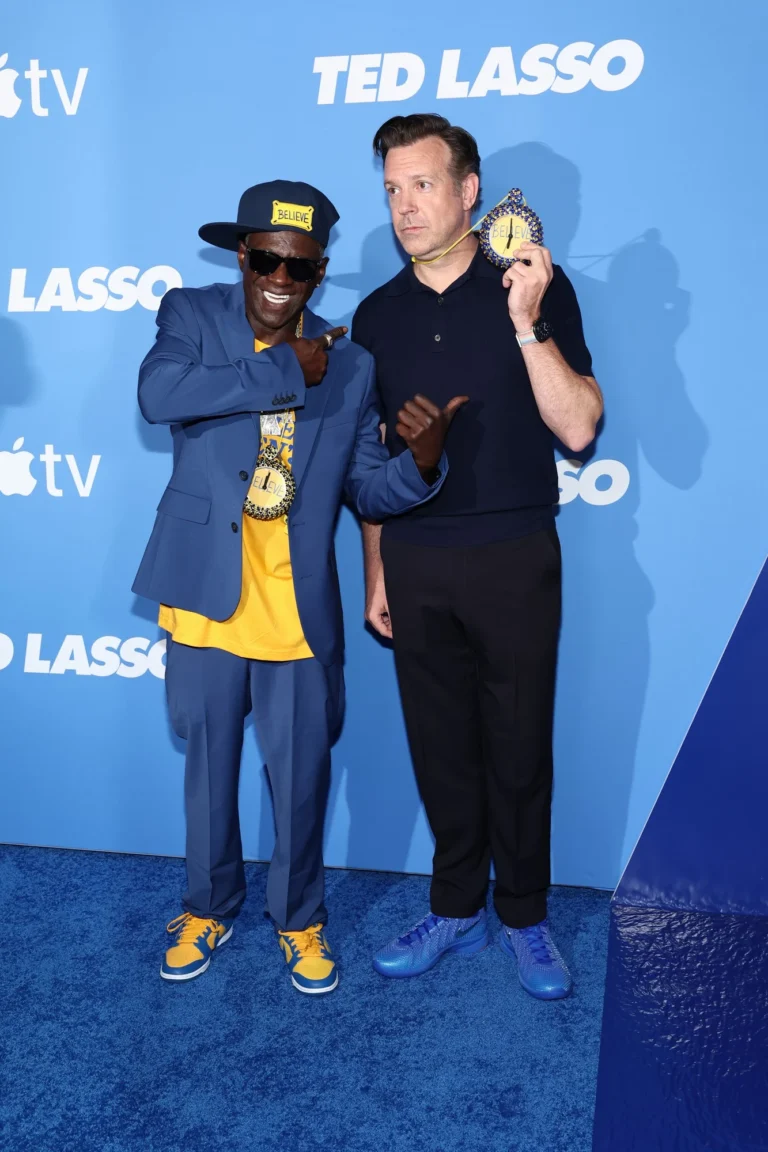 Flavor Flav Gives Custom Clock Necklace To Jason Sudeikis At ‘Ted Lasso’ Season 4 Premiere