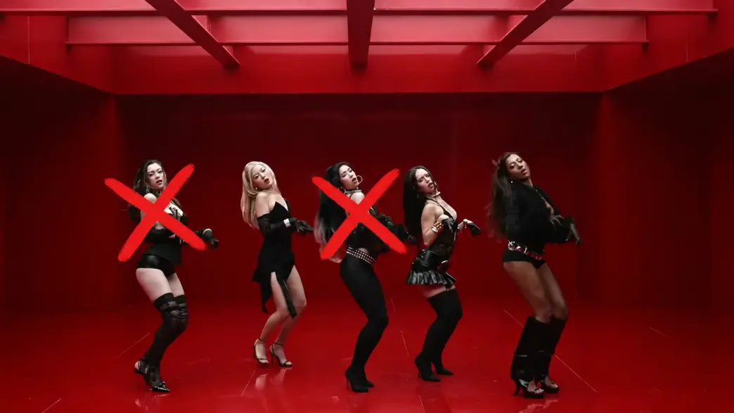 KATSEYE members in the Animal music video with red X marks over two members currently on hiatus