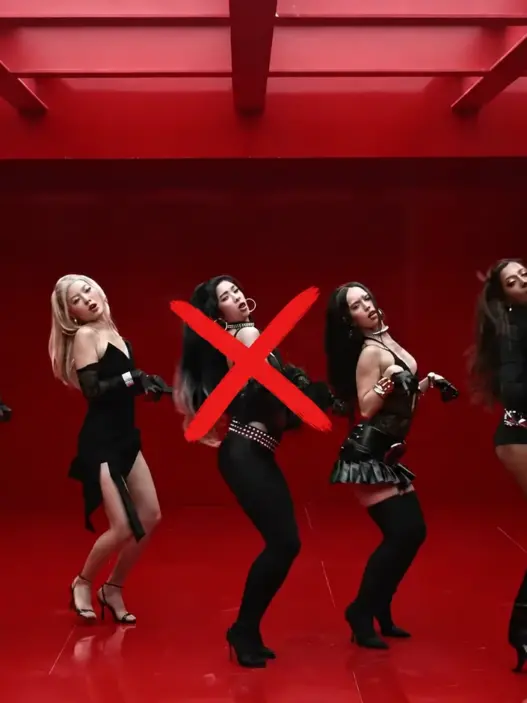 KATSEYE members in the Animal music video with red X marks over two members currently on hiatus