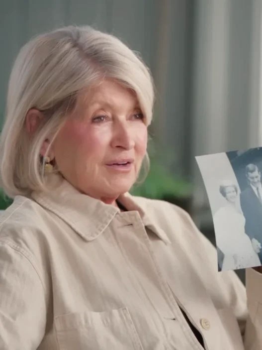Martha Stewart looking back at photographs from her life and career for PEOPLE