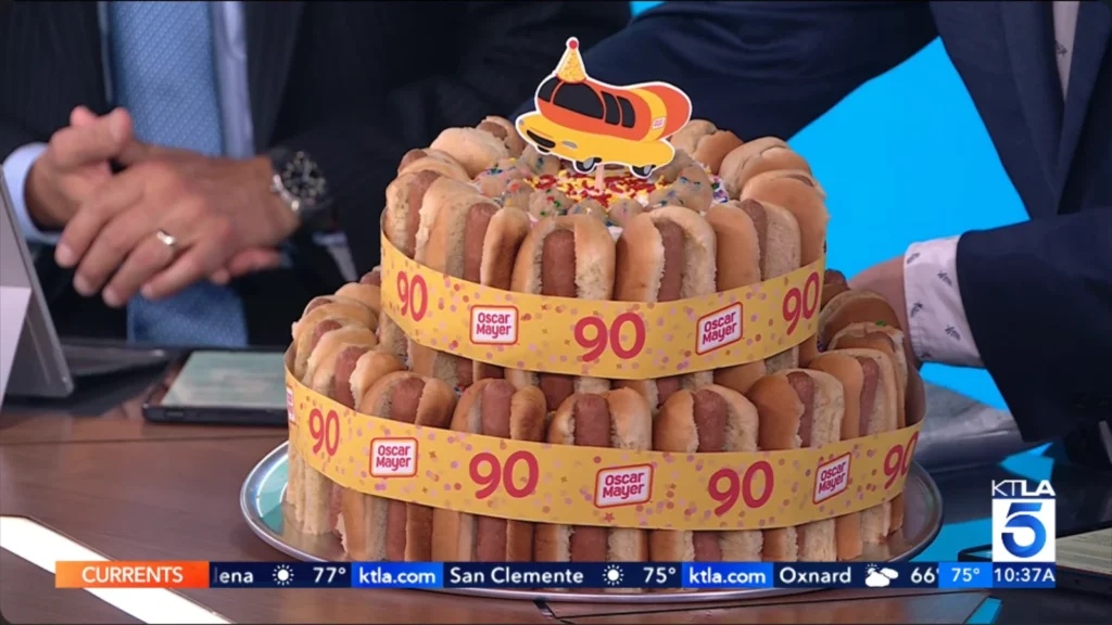 Still accompanying KTLA’s look at the Wienermobile’s 90th birthday