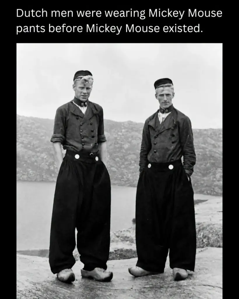 Dutch fishermen in traditional regional clothing with wide trousers