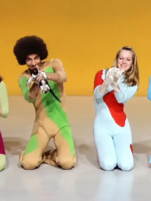 Four Ballet Zoom dancers kneel in colorful 1970s costumes during a psychedelic cat-themed television performance