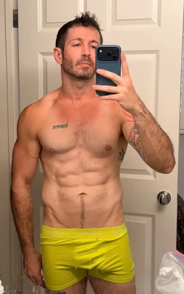 Brandon Frankel posing in underwear while celebrating American Horror Story 13 reaching No. 1 on Hulu
