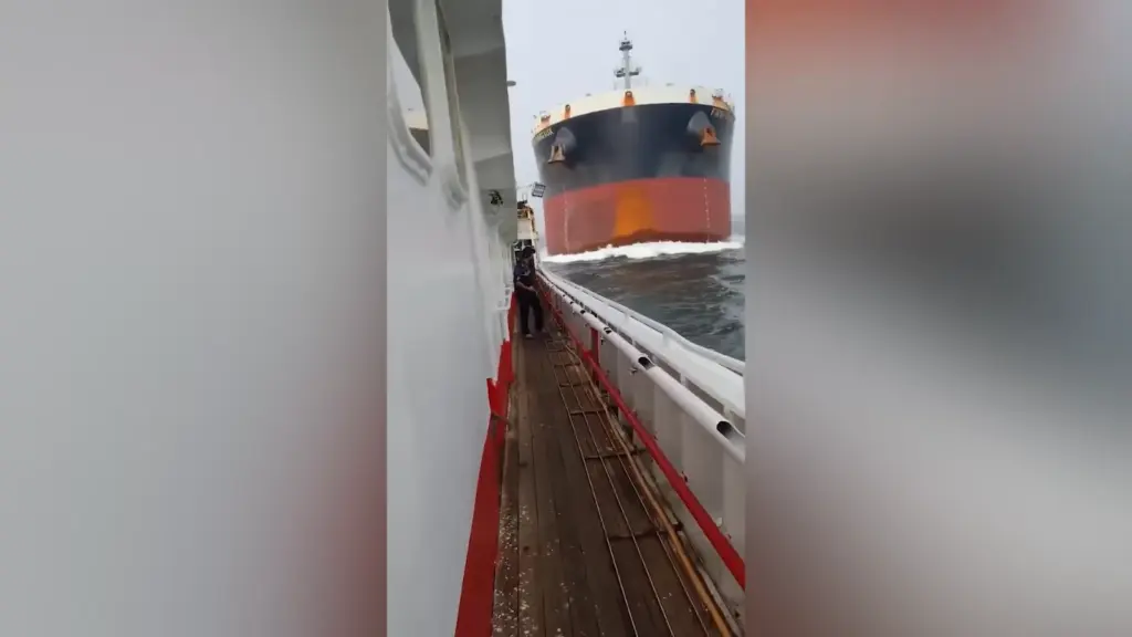 Crew aboard Luqing Yuanyu 108 cling to the railings during its collision with First Margaux in the Singapore Strait
