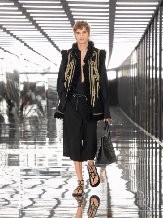 Fendi Spring Summer 2027 menswear look with long coat, fur stole and shorts