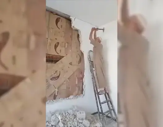 Abu Bilal uncovering his hidden library after 15 years