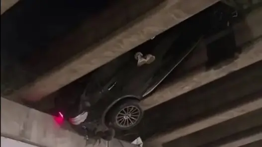 Vehicle wedged in an Atlanta I-20 overpass after a single-car crash