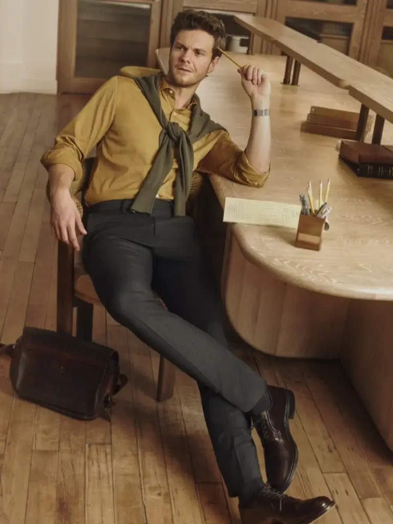 Jack Quaid in mustard shirt and olive sweater for Bonobos Fall 2026