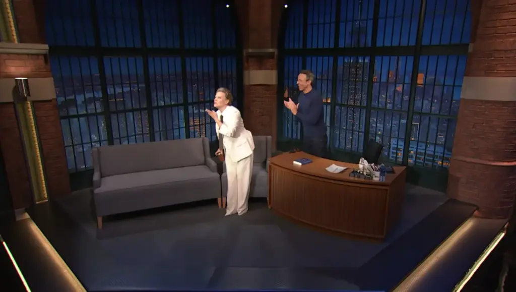 Kate McKinnon speaking with Seth Meyers on Late Night
