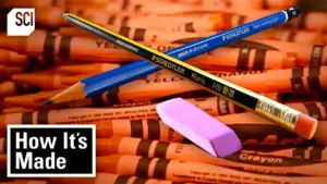 Art supplies being manufactured in a video showing how crayons, colored pencils and other familiar materials are made