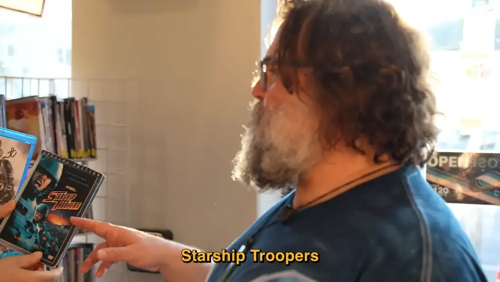 Michel Gondry and Jack Black selecting movies at Vidiots