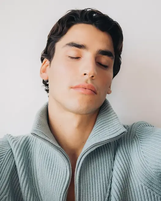 Model Marco Chiricallo lounging in a textured Missoni sweater and white Polo Ralph Lauren boxers for Des Intimités, photographed by Luca Fancellu