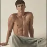 Model Dominik Schmidt shirtless in light-colored trousers for a MMSCENE Style Stories editorial photographed by Lukas Kimlicka