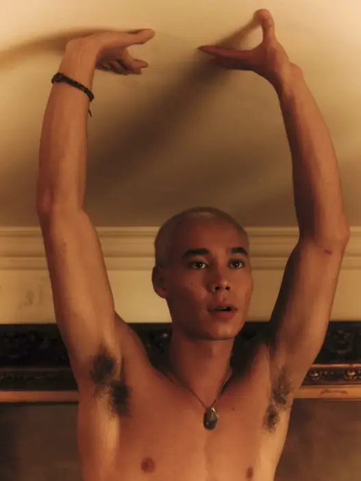 Bleached-haired male model posing shirtless with both arms raised in Lurking, photographed by Daniel Waiswol for FY Magazine! Online