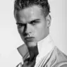 Black-and-white close-up of Treston Francis in a white shirt photographed by Frank Louis