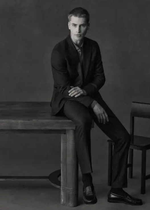 Model wearing Octobre Éditions limited-edition anthracite tailoring for the brand’s 10th anniversary