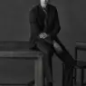 Model wearing Octobre Éditions limited-edition anthracite tailoring for the brand’s 10th anniversary